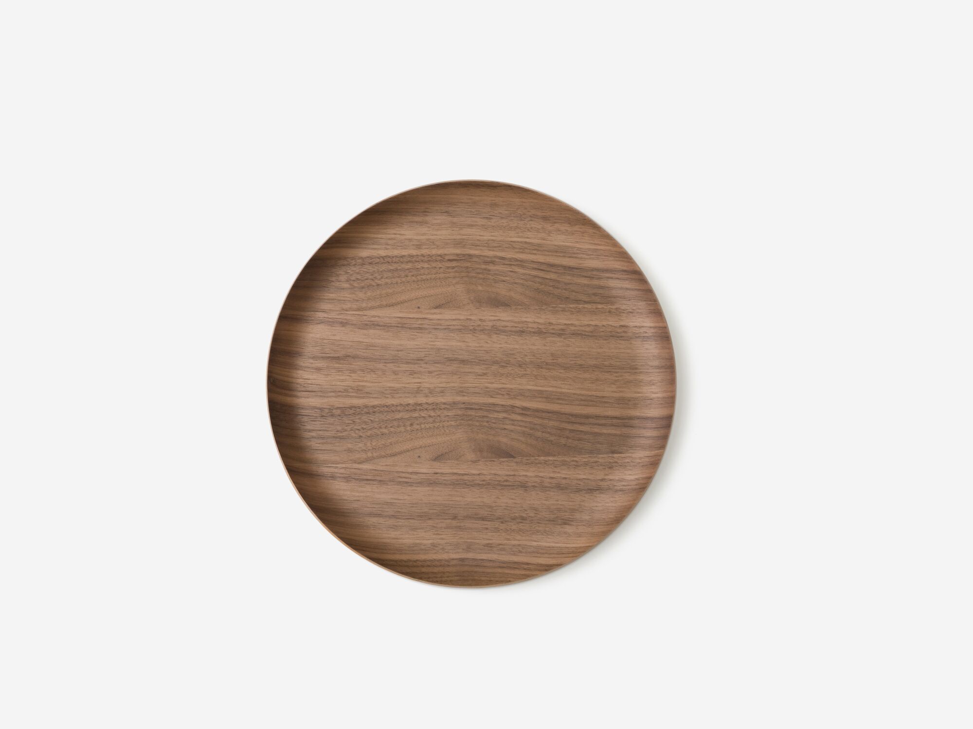 Top view of small round walnut serving tray